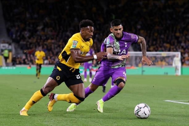 Adama Traore of Wolverhampton Wanderers battles for possession with Cristian Romero of Tottenham Hotspur during the Carabao Cup Third Round match...
