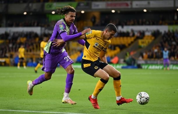 Conor Coady of Wolverhampton Wanderers shields the ball from Dele Alli of Tottenham Hotspur during the Carabao Cup Third Round match between...