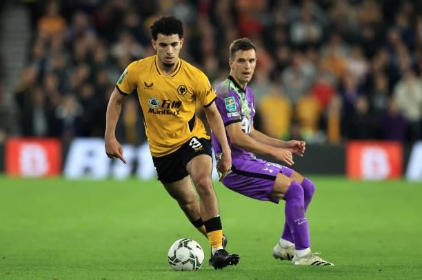 Rayan Ait-Nouri of Wolverhampton Wanderers breaks away from Giovani Lo Celso of Tottenham Hotspur during the Carabao Cup Third Round match between...