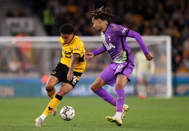 Ki-Jana Hoever of Wolverhampton Wanderers is closed down by Dele Alli of Tottenham Hotspur during the Carabao Cup Third Round match between...