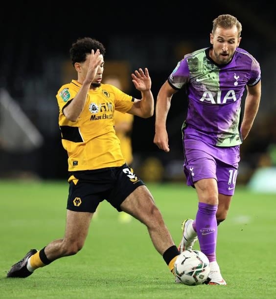 Harry Kane of Tottenham Hotspur battles for possession with Rayan Ait-Nouri of Wolverhampton Wanderers during the Carabao Cup Third Round match...