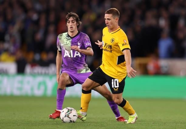 Daniel Podence of Wolverhampton Wanderers runs with the ball under pressure from Bryan Gil of Tottenham Hotspur during the Carabao Cup Third Round...