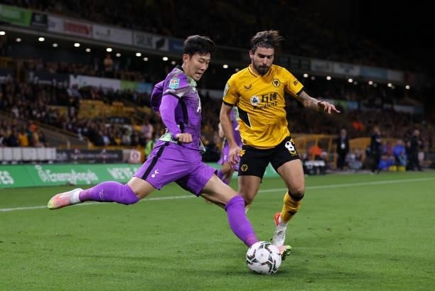 Heung-Min Son of Tottenham Hotspur is closed down by Ruben Neves of Wolverhampton Wanderers during the Carabao Cup Third Round match between...