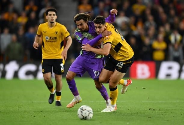 Max Kilman of Wolverhampton Wanderers battles for possession with Dele Alli of Tottenham Hotspur during the Carabao Cup Third Round match between...