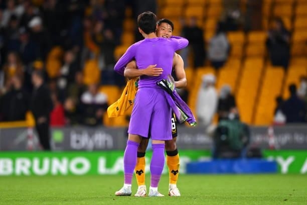 Heung-Min Son of Tottenham Hotspur embraces Hwang Hee-chan of Wolverhampton Wanderers after the Carabao Cup Third Round match between Wolverhampton...