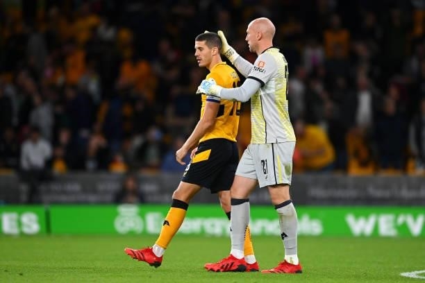 John Ruddy of Wolverhampton Wanderers consoles teammate Conor Coady after missing the decisive penalty in the penalty shoot out during the Carabao...