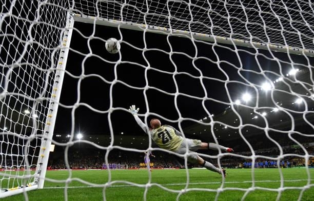 John Ruddy of Wolverhampton Wanderers fails to save a penalty taken by Bryan Gil of Tottenham Hotspur in the penalty shoot out during the Carabao Cup...