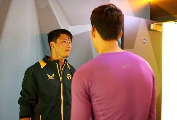 Hee Chan Hwang of Wolverhampton Wanderers speaks with Heung-Min Son of Tottenham Hotspur following the Carabao Cup Third Round match between...