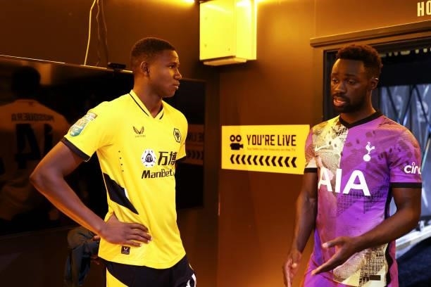 Yerson Mosquera of Wolverhampton Wanderers speaks with Davinson Sanchez of Tottenham Hotspur following the Carabao Cup Third Round match between...