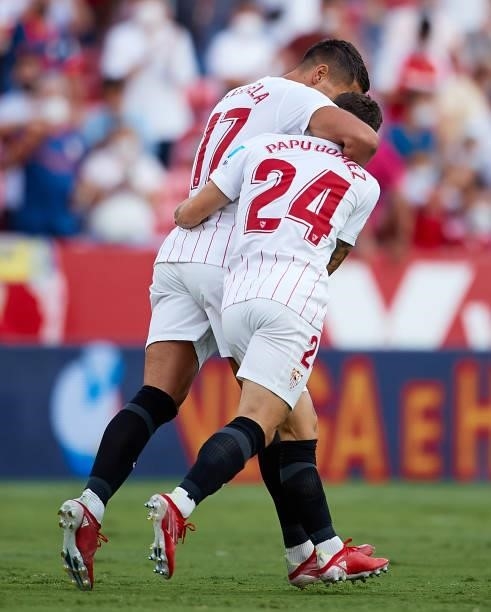 Alejandro Papu Gomez of Sevilla FC celebrates scoring his teams first goal with Erik Lamela during the La Liga Santander match between Sevilla FC and...