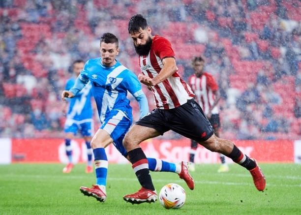 Asier Villalibre of Athletic Club duels for the ball with Ivan Balliu of Rayo Vallecano during the La Liga Santander match between Athletic Club and...