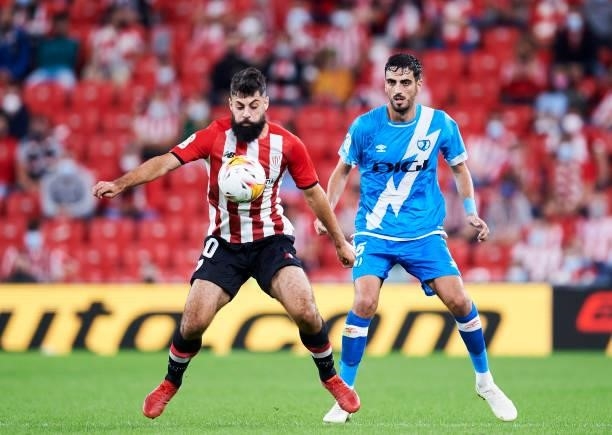 Asier Villalibre of Athletic Club duels for the ball with Alejandro Catena of Rayo Vallecano during the La Liga Santander match between Athletic Club...
