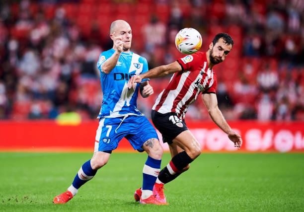 Inigo Lekue of Athletic Club duels for the ball with Isi Palazon of Rayo Vallecano during the La Liga Santander match between Athletic Club and Rayo...