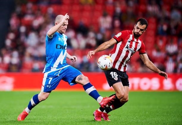 Inigo Lekue of Athletic Club duels for the ball with Isi Palazon of Rayo Vallecano during the La Liga Santander match between Athletic Club and Rayo...