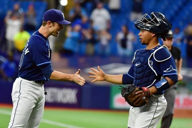 David Robertson and Francisco Mejia of the Tampa Bay Rays celebrate after defeating the Toronto Blue Jays 7-1 to clinch a playoff berth at Tropicana...