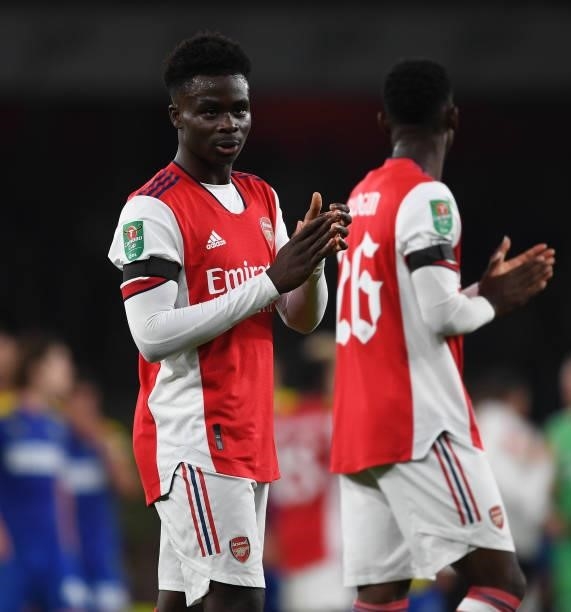 Bukayo Saka applauds the Arsenal fans after the Carabao Cup Third Round match between Arsenal and AFC Wimbledon at Emirates Stadium on September 22,...