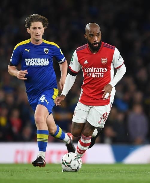 Alex Lacazette of Arsenal takes on Alex Woodyard of Wimbledon during the Carabao Cup Third Round match between Arsenal and AFC Wimbledon at Emirates...