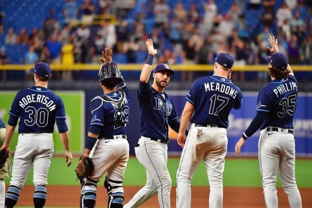 Kevin Kiermaier of the Tampa Bay Rays celebrates with teammates after defeating the Toronto Blue Jays 7-1 to clinch a playoff berth at Tropicana...