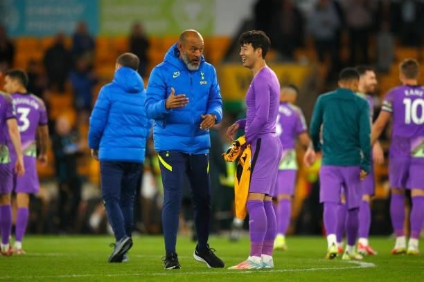 Tottenham manager Nuno Espirito Santo jokes wth Heung-Min Son during the Carabao Cup Third Round match between Wolverhampton Wanderers and Tottenham...
