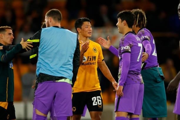 South Korean footballers Hee-Chan Hwang of Wolverhampton Wanderers and Heung-Min Son of Tottenham Hotspur chat following the Carabao Cup Third Round...