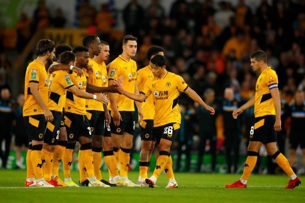 Hee-Chan Hwang of Wolverhampton Wanderers is congratulated by teammates following his goal in the penalty shoot-out during the Carabao Cup Third...