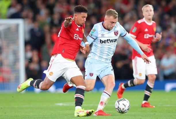 Jarrod Bowen of West Ham United holds off a challenge Jadon Sancho of Manchester United during the Carabao Cup Third Round match between Manchester...