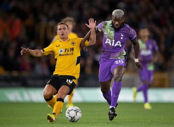 Tanguy Ndombele of Tottenham Hotspur and Daniel Podence of Wolverhampton Wanderers in action during the Carabao Cup Third Round match between...