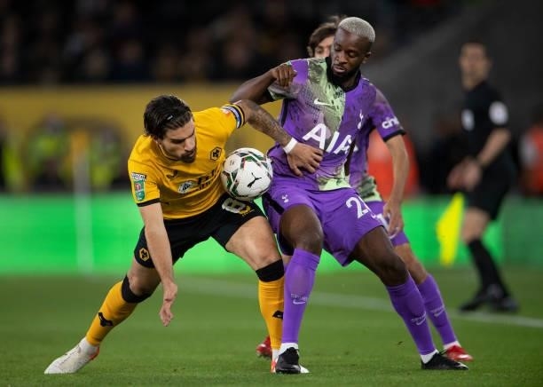 Ruben Neves of Wolverhampton Wanderers and Tanguy Ndombele of Tottenham Hotspur in action during the Carabao Cup Third Round match between...