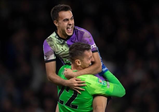 Sergio Reguilón and goalkeeper Pierluigi Gollini of Tottenham Hotspur celebrate after winning the penalty shoot out during the Carabao Cup Third...