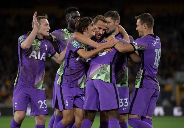 Tottenham Hotspur players celebrate with team mate Tanguy Ndombele, scorer of the first goal, during the Carabao Cup Third Round match between...
