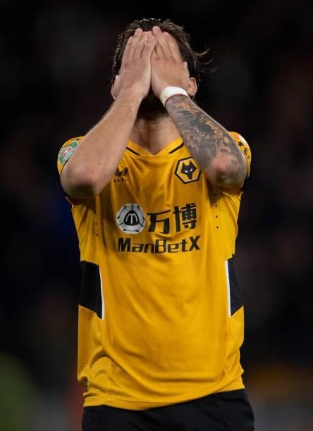 Ruben Neves of Wolverhampton Wanderers holds his head in his hands after missing his penalty during the shoot out of the Carabao Cup Third Round...