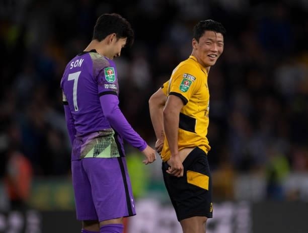 Hee Chan Hwang of Wolverhampton Wanderers and Heung-Min Son of Tottenham Hotspur after the Carabao Cup Third Round match between Wolverhampton...