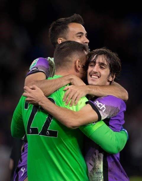 Sergio Reguilón, goalkeeper Pierluigi Gollini and Bryan Gil of Tottenham Hotspur celebrate after winning the penalty shoot out during the Carabao Cup...