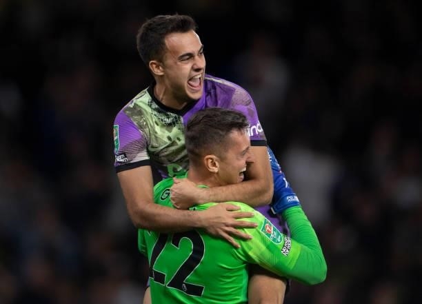 Sergio Reguilón and goalkeeper Pierluigi Gollini of Tottenham Hotspur celebrate after winning the penalty shoot out during the Carabao Cup Third...