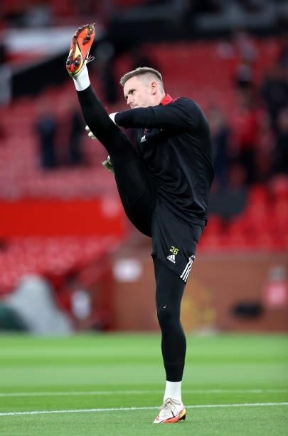 Dean Henderson of Manchester United warms up prior to the Carabao Cup Third Round match between Manchester United and West Ham United at Old Trafford...