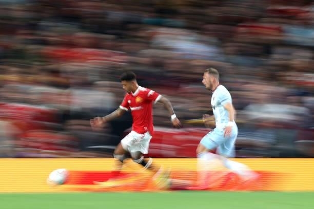 Jadon Sancho of Manchester United is closed down by Vladimir Coufal of West Ham during the Carabao Cup Third Round match between Manchester United...