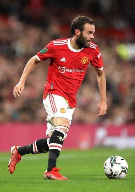 Juan Mata of Manchester United runs with the ball during the Carabao Cup Third Round match between Manchester United and West Ham United at Old...
