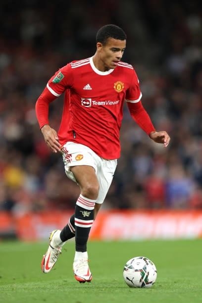 Mason Greenwood of Manchester United runs with the ball during the Carabao Cup Third Round match between Manchester United and West Ham United at Old...