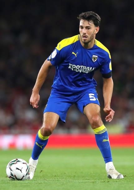 Will Nightingale of AFC Wimbledon controls the ball during the Carabao Cup Third Round match between Arsenal and AFC Wimbledon at Emirates Stadium on...
