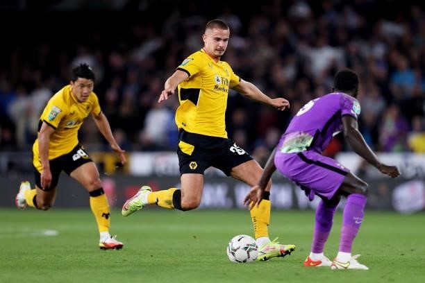 Leander Dendoncker of Wolverhampton Wanderers passes the ball which leads to assisting his team's second goal scored by Daniel Podence during the...