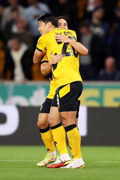Daniel Podence celebrates scoring his team's second goal with Hee-chan Hwang of Wolverhampton Wanderers during the Carabao Cup Third Round match...