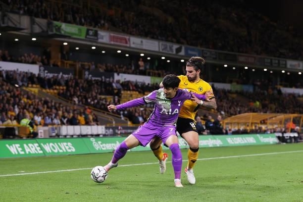 Son Heung-Min of Tottenham Hotspur is challenged by Ruben Neves of Wolverhampton Wanderers during the Carabao Cup Third Round match between...