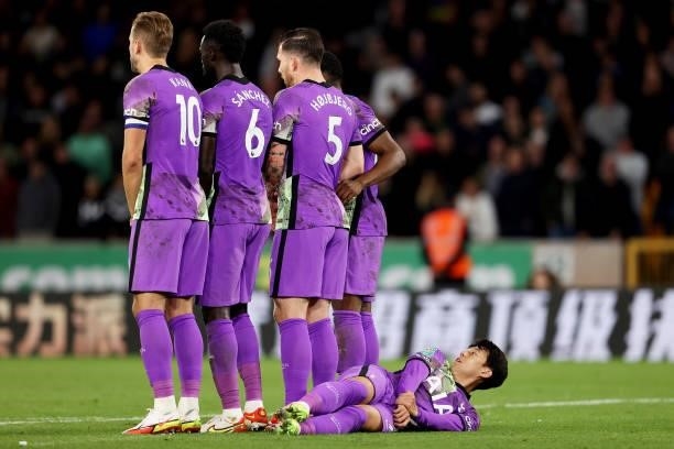 Son Heung-Min of Tottenham Hotspur lays down behind the wall during the Carabao Cup Third Round match between Wolverhampton Wanderers and Tottenham...