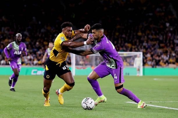 Adama Traore of Wolverhampton Wanderers is challenged by Cristian Romero of Tottenham Hotspur during the Carabao Cup Third Round match between...
