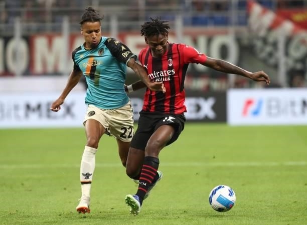 Rafael Leao of AC Milan competes for the ball with Tyronne Ebuehi of Venezia FC during the Serie A match between AC Milan and Venezia FC at Stadio...