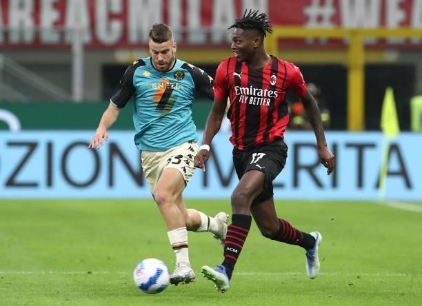 Rafael Leao of AC Milan competes for the ball with Domen Crnigoj of Venezia FC during the Serie A match between AC Milan and Venezia FC at Stadio...