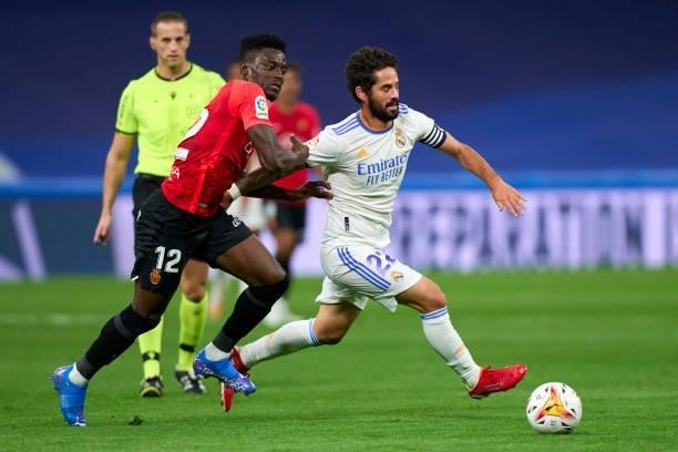 Isco of Real Madrid CF battle for the ball with Iddrisu Baba of RDC Mallorca during the La Liga Santander match between Real Madrid CF and RCD...