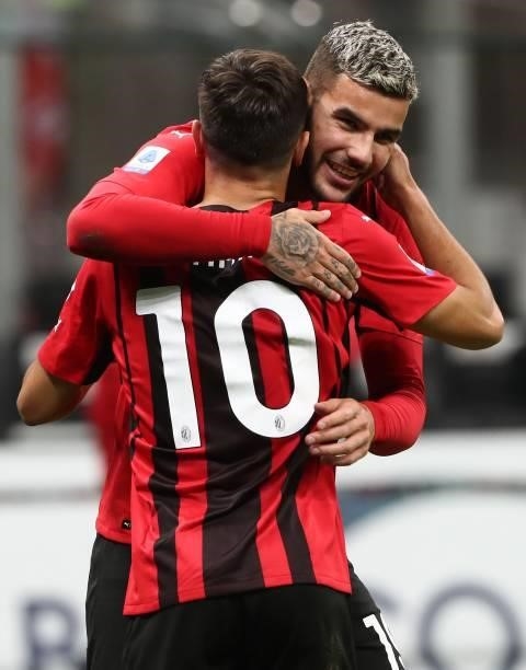 Brahim Diaz of AC Milan celebrates with his team-mate Theo Hernandez after scoring the opening goal during the Serie A match between AC Milan and...