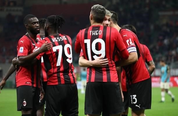 Theo Hernandez of AC Milan celebrates his goal with his team-mate Alexis Saelemaekers during the Serie A match between AC Milan and Venezia FC at...