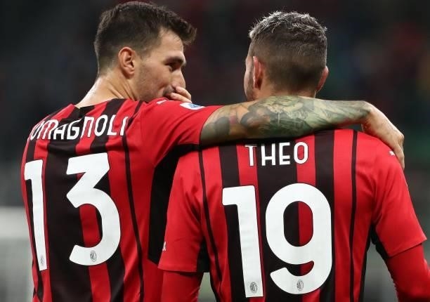 Theo Hernandez of AC Milan celebrates his goal with his team-mate Alessio Romagnoli during the Serie A match between AC Milan and Venezia FC at...